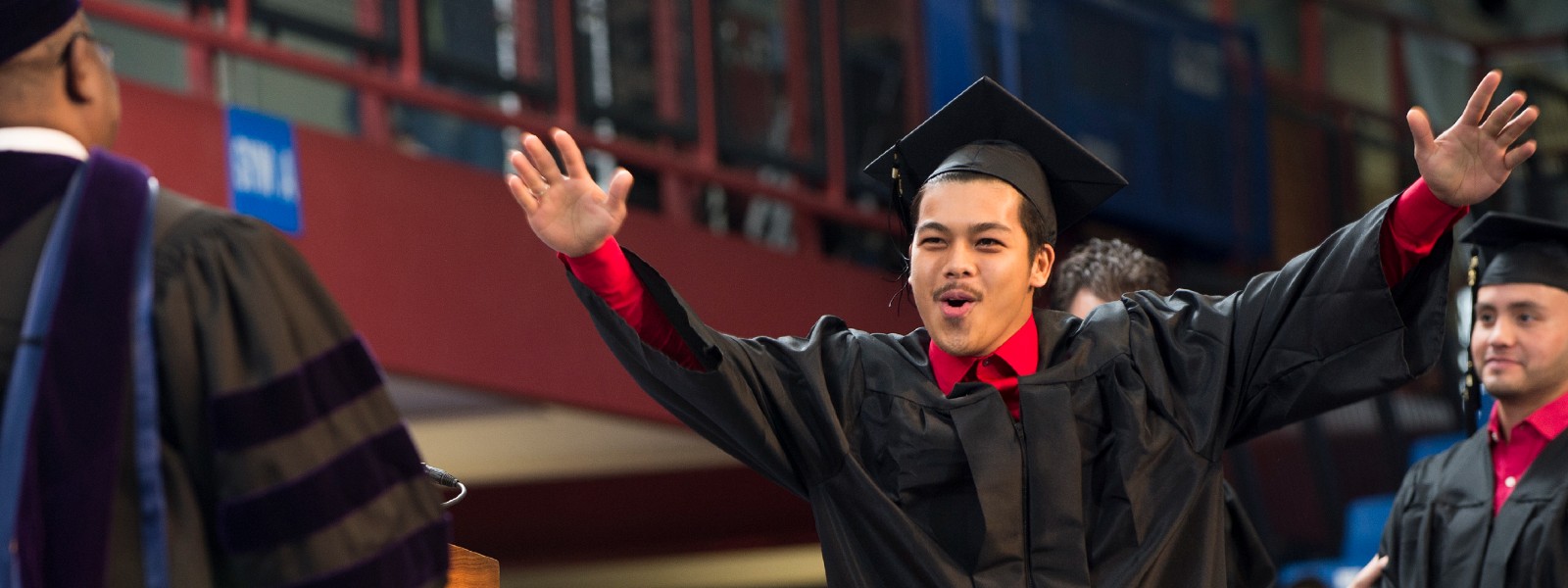 Excited student at graduation ceremony