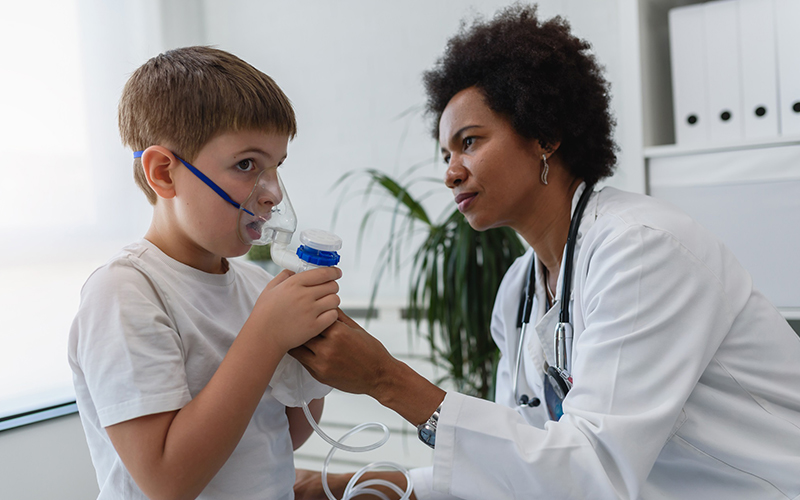 A respiratory care therapist treats a patient