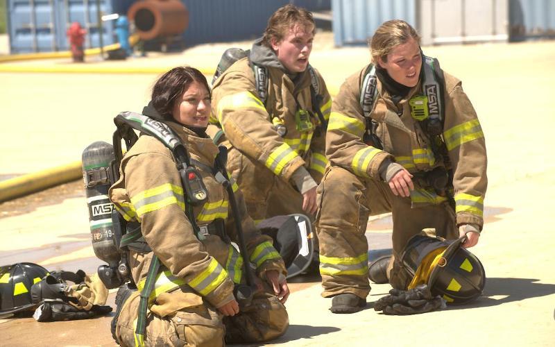 Jeanette Silva Haro, left, trains hard with her fellow Basic Operations Firefighter classmates.