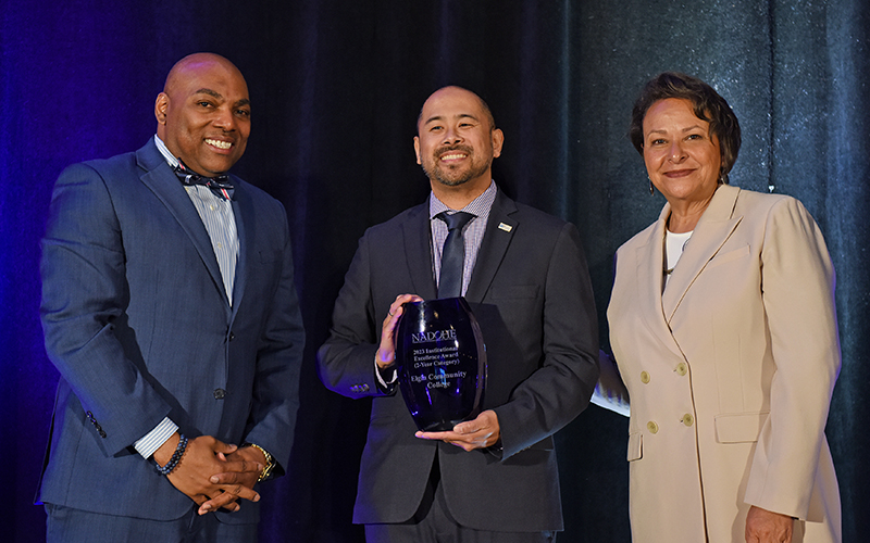 Anthony Ramos, EdD, ECC’s executive director of equity, diversity, and inclusion (center) with NADOHE President Paulette Granberry Russell and Interim Awards Chair James Felton III. Photo credit: Tim Trumble for NADOHE