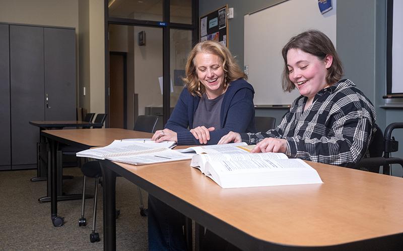Liddy Hope, PhD, assistant professor of human services, assists ECC student Jess Heiser