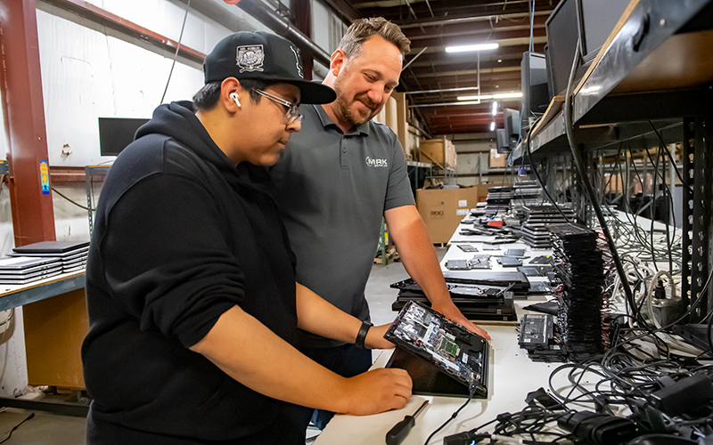 ECC student Joseph Patino (left) with Joe Ruffalo, vice president of operations at MRK