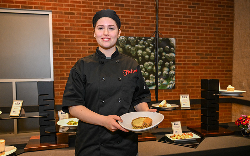 ECC culinary student Lynn Stringini, first-place winner of the annual Fisher Nuts scholarship recipe contest with her Pistachio Panna Cotta and Pumpkin Chiffon Tartlet