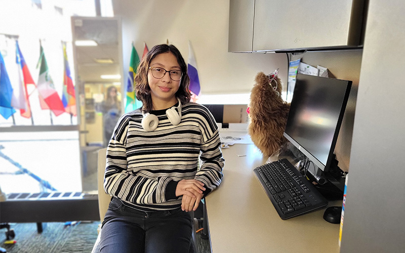 A student sits at a desk
