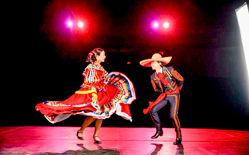Students dancing on a stage