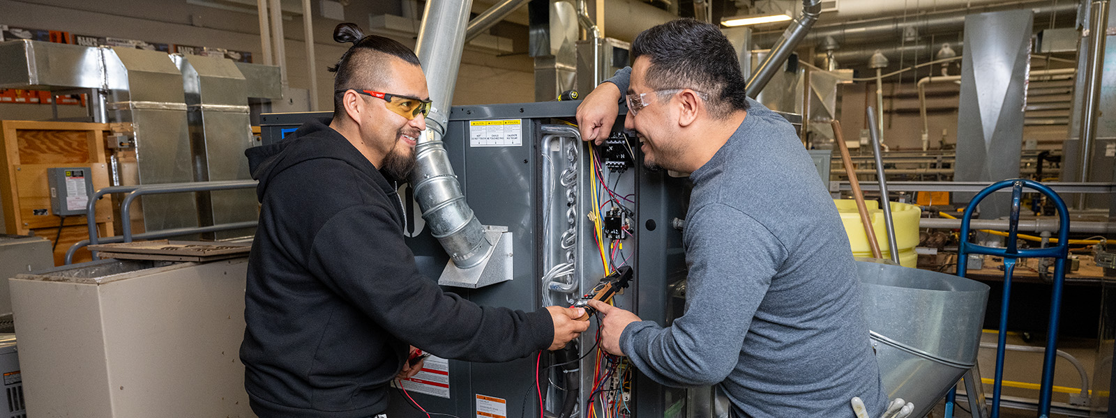 Students working on a machine
