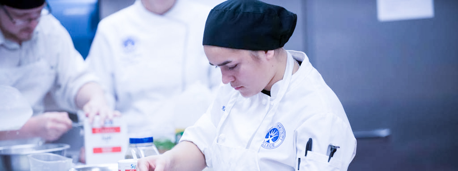 Group of students cooking in the kitchen