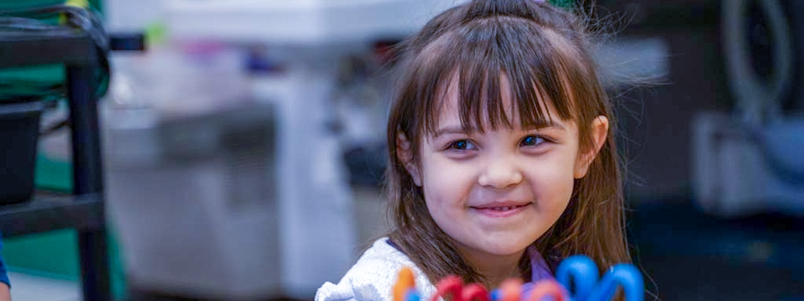 A little girl smiling at the camera