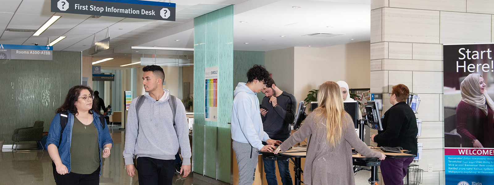 Students in hallway near the first stop desk.