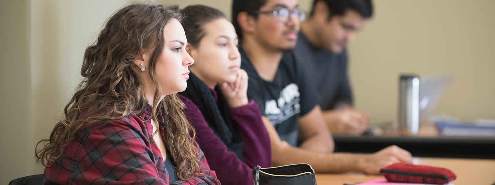 Students sitting and listing to a lecture during class.