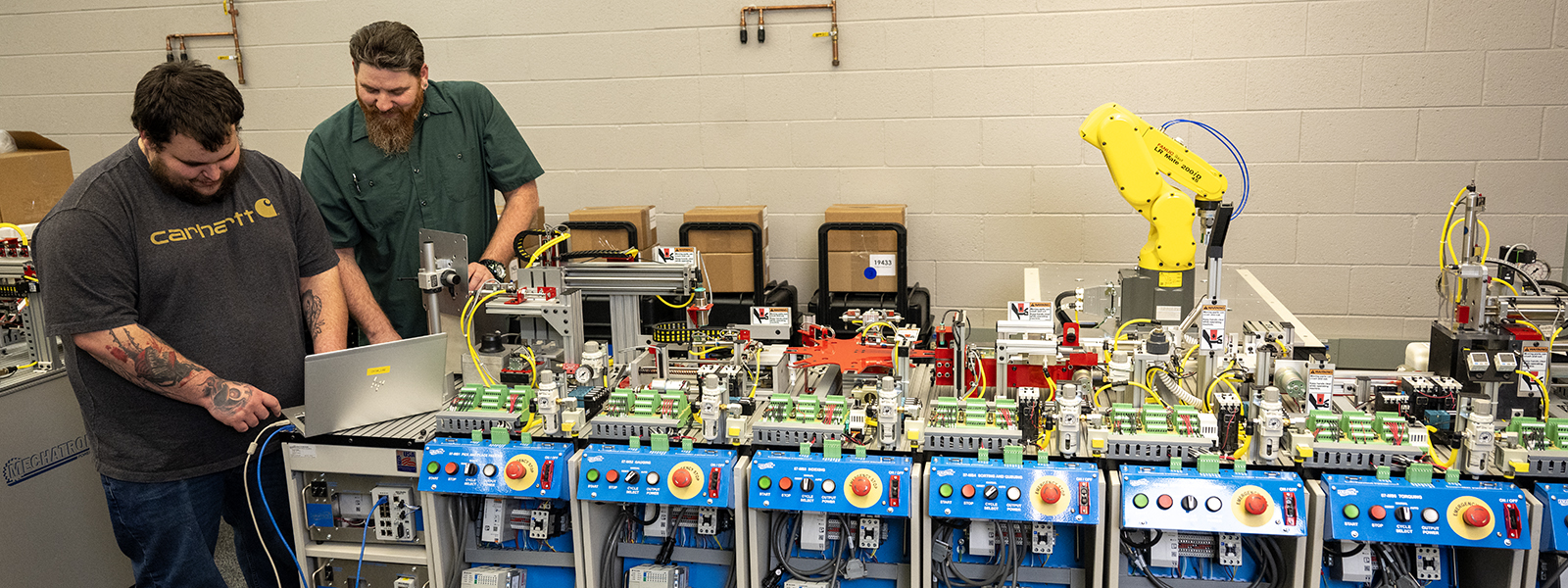 Student and instructor looking over equipment.