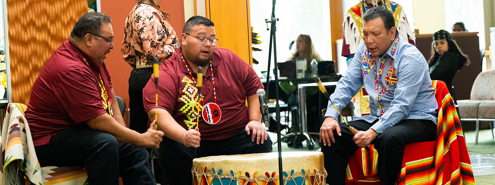 Members of the Blackhawk dance troupe dancing to the beat of the drum