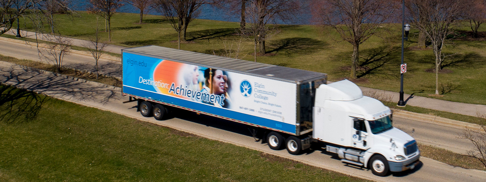 Aerial view of a truck driving by Lake Spartan in Elgin, IL.